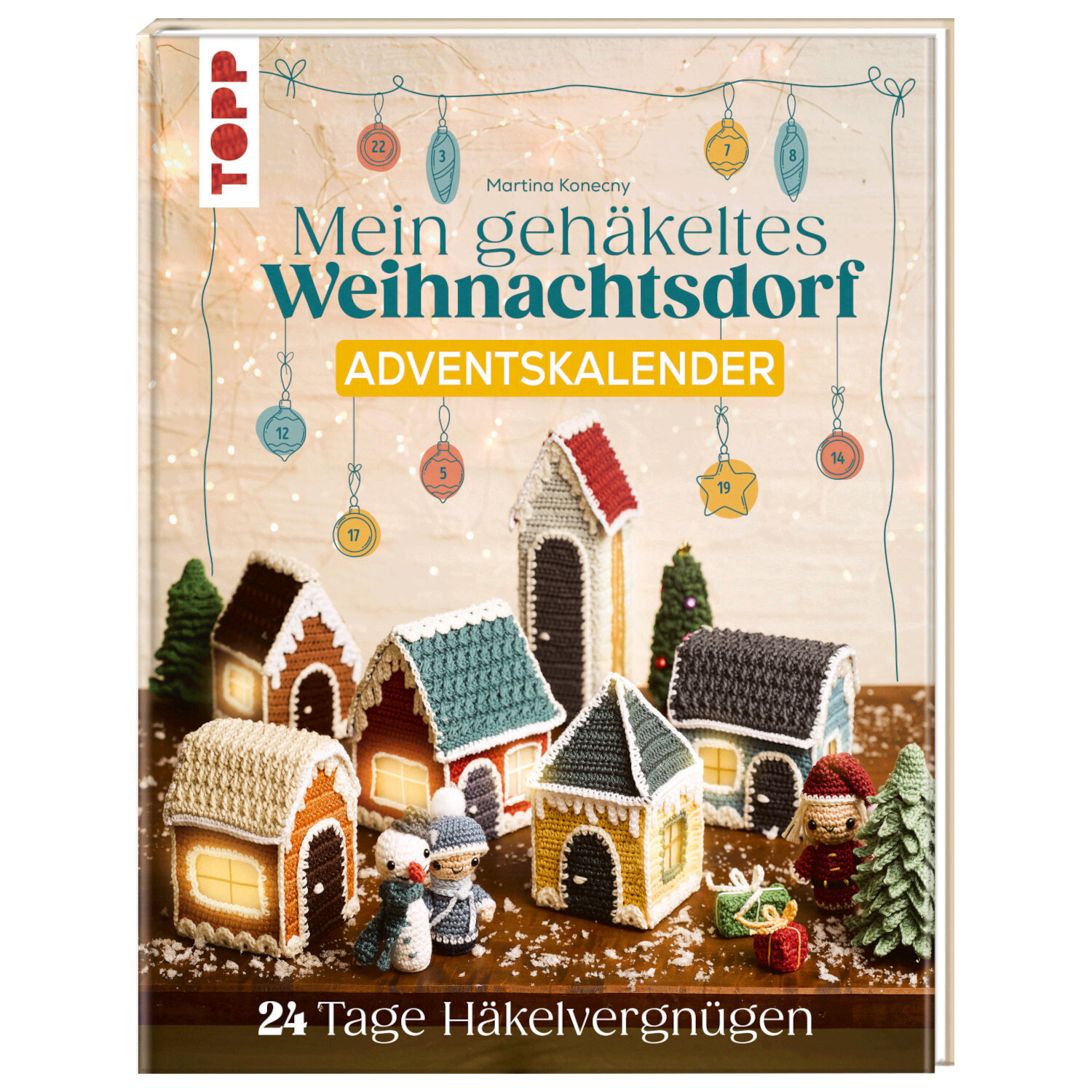 Mein gehäkeltes Weihnachtsdorf - Adventskalenderbuch von TOPP zeigt ein buntes, gehäkeltes Dorf mit festlichen Details auf dem Cover.