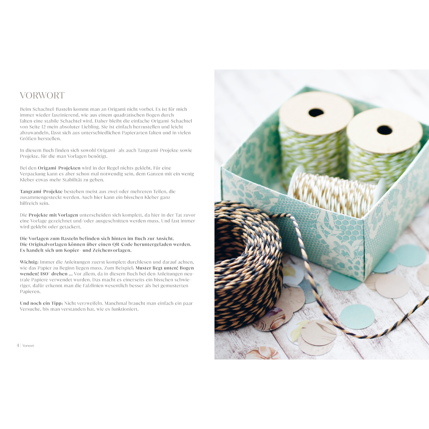 Das große Buch der Schachteln: Dekorative Box mit Garnrollen in Pastellfarben, ideal für kreative Bastelprojekte.