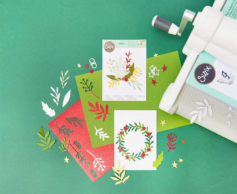 Sizzix Maschine in Anwendung mit Schablonen und fertiger Weihnachtskarte