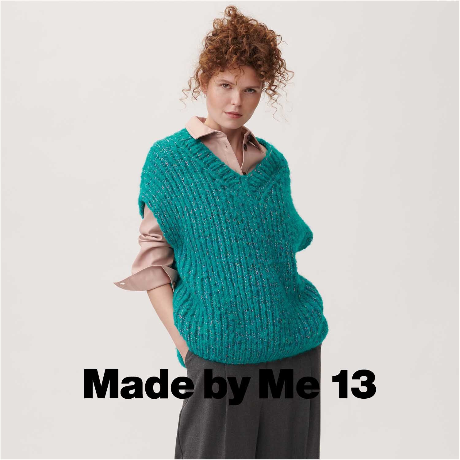 Fashion Light Luxury: Frau trägt türkisfarbenen Strickpullover von Rico Design, kombiniert mit rosa Hemd und grauer Hose.