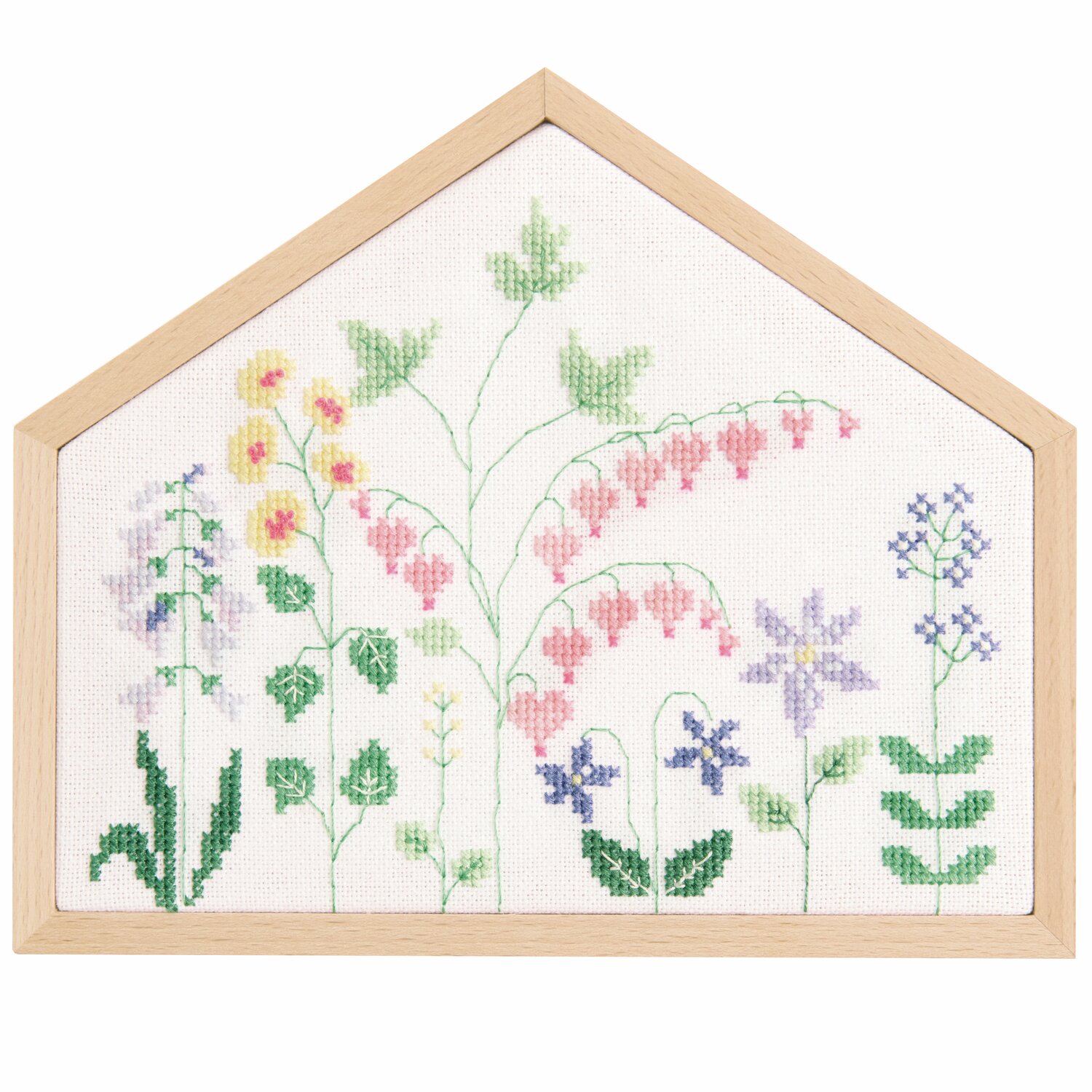 Stickpackung Gezählter Kreuzstich Blumenwiese zeigt bunte Blumen auf weißem Stoff, gerahmt in Holz. Größe: 20x16,5cm. Marke: Rico Design.