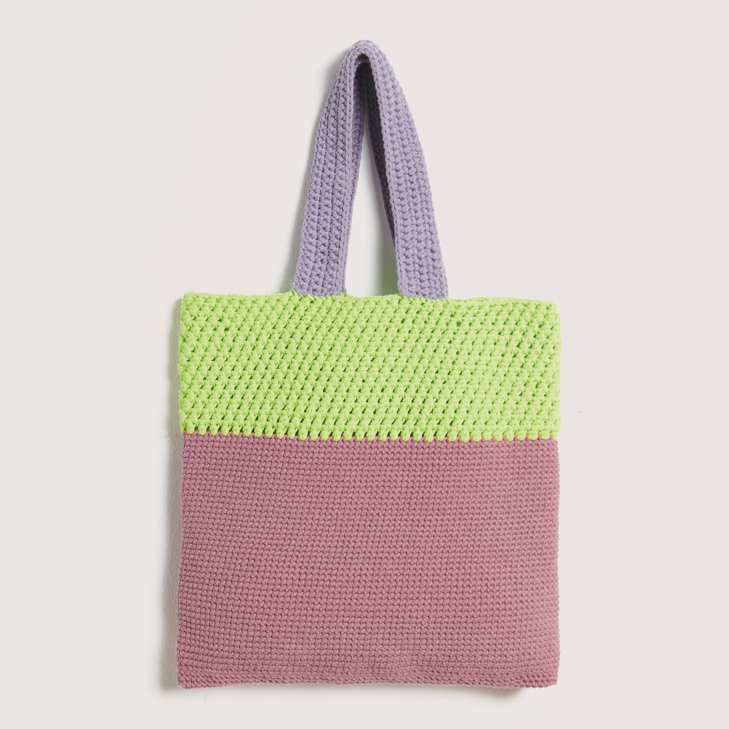 Häkelset Tasche Modell 28 aus Die Neue Masche Nr. 9, zweifarbig in Lila und Gelb, mit robusten Henkeln. Ideal für den Frühling und Sommer.