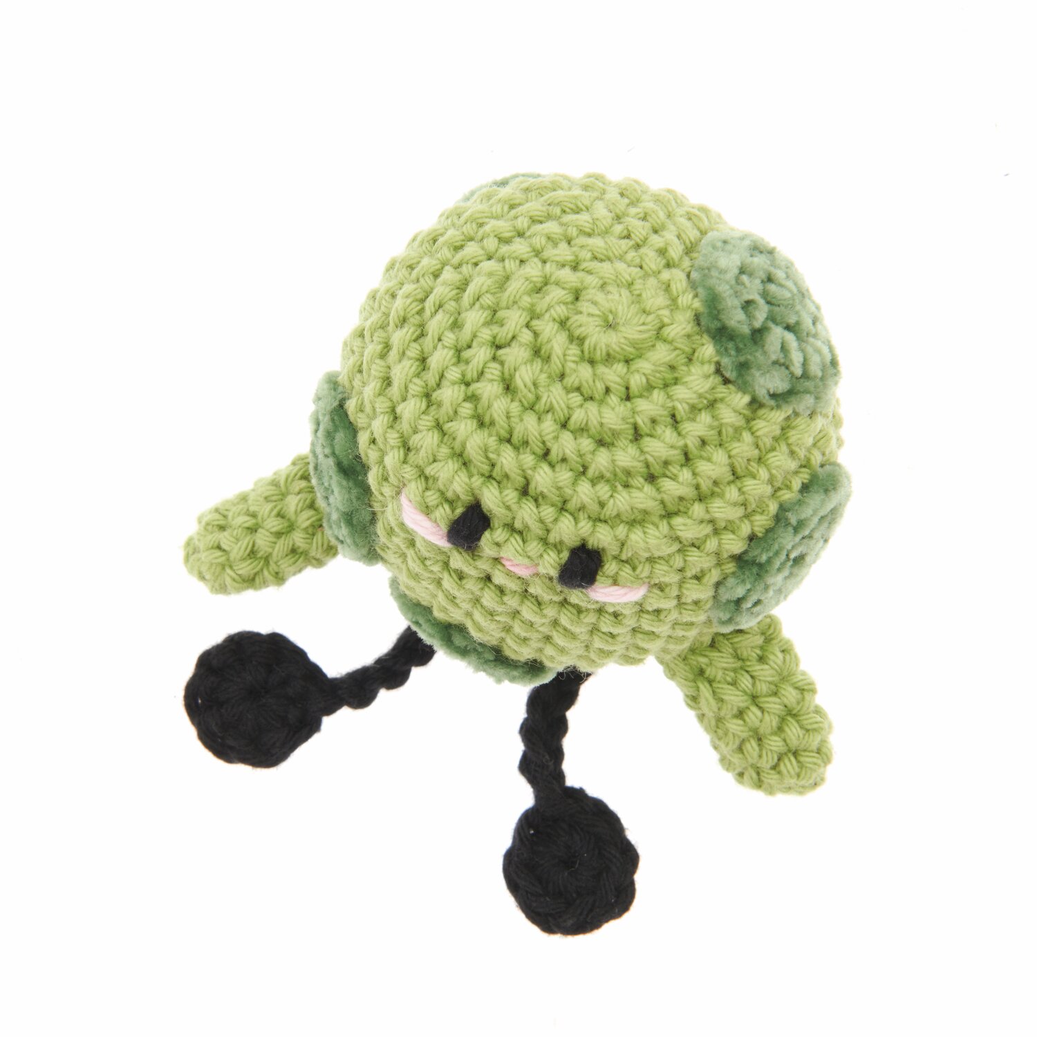 Ricorumi Nilli Nilli, ein gehäkeltes Spielzeug in Pistazie und Schwarz, aus der Ricorumi Rainbow Weirdos Kollektion.
