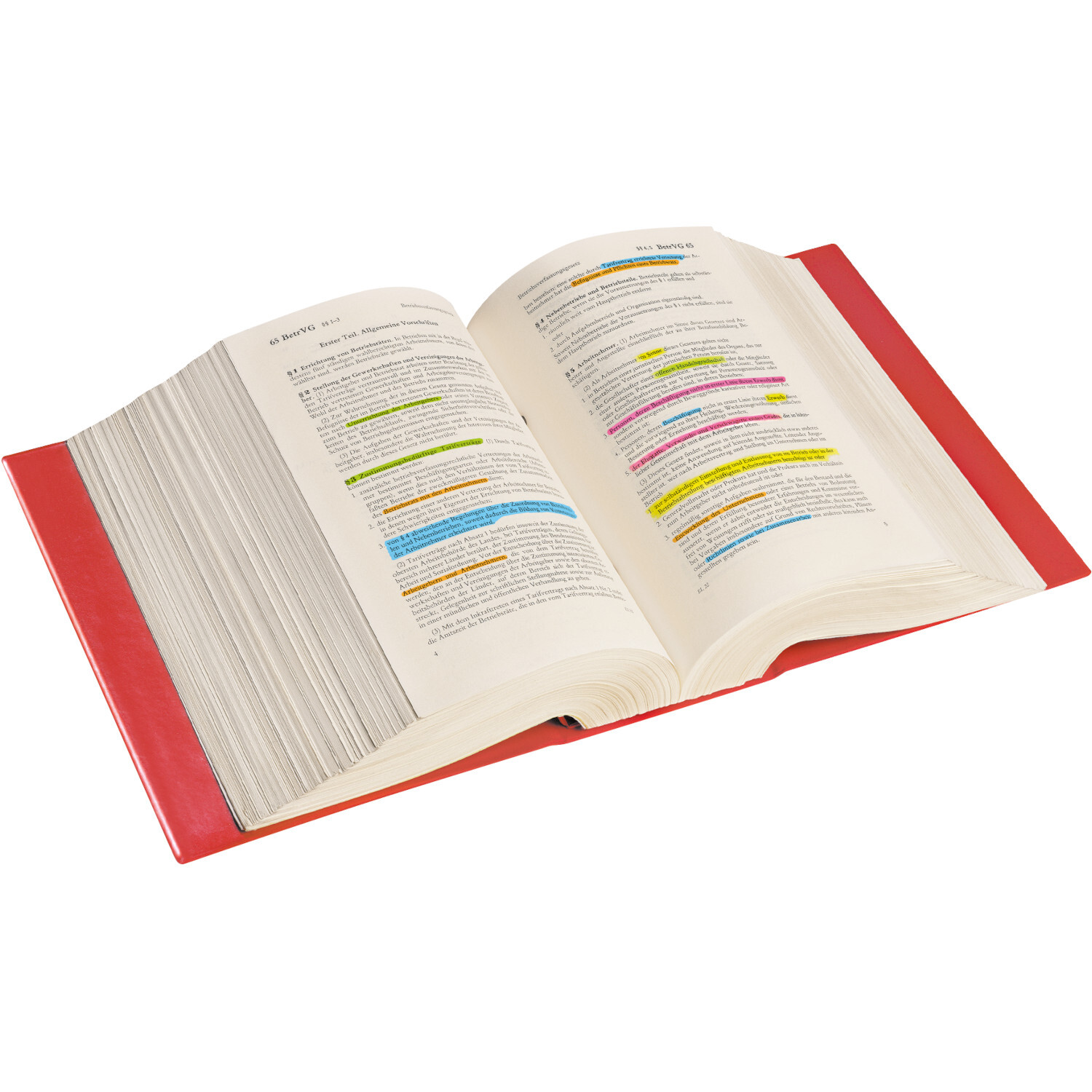 Jumbo Grip Textliner Farbe Rosa von Faber-Castell Jumbo Grip Textliner: Geöffnetes Buch mit farbigen Markierungen in Gelb, Blau und Pink, rote Buchdeckel.