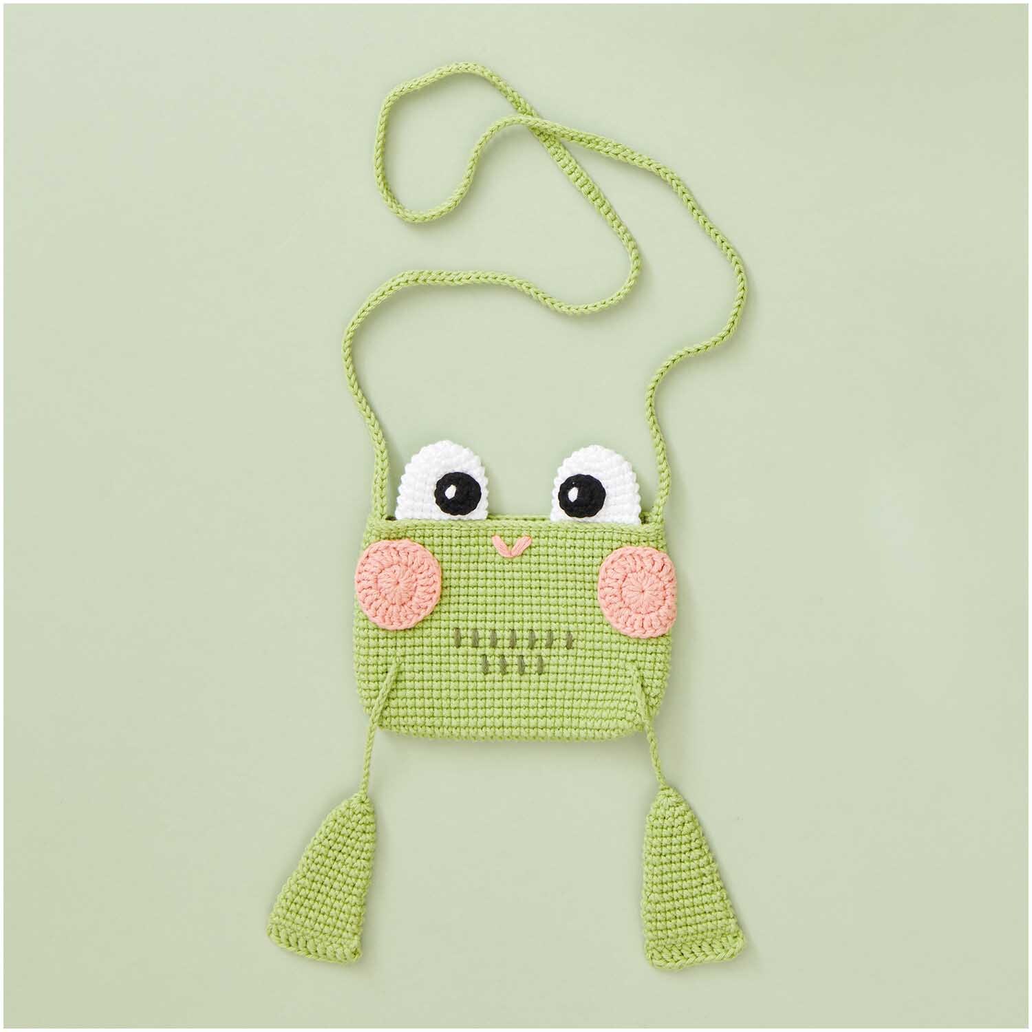 Creative Ricorumi dk: Niedliche gehäkelte Froschtasche mit großen Augen und langen Beinen, ideal für Kinder.