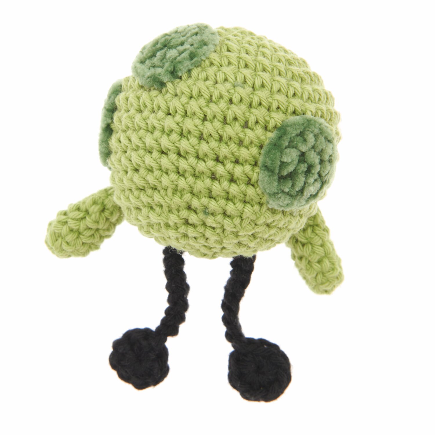 Ricorumi Nilli Nilli, ein gehäkeltes Wesen in Pistazie mit schwarzen Beinen, aus der Serie Ricorumi Rainbow Weirdos.