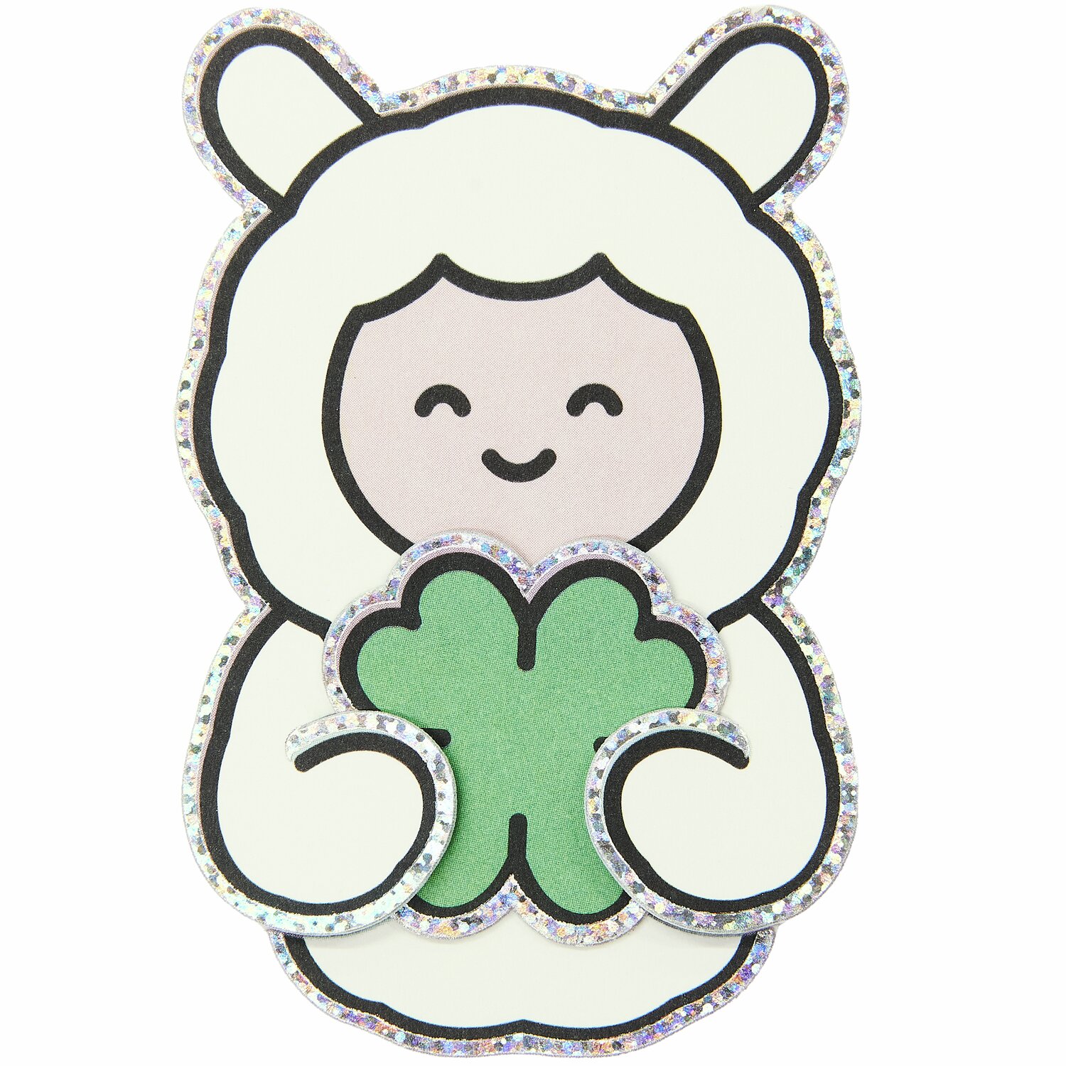 Paper Poetry Clip-Ons Chingu Sky: Niedliches Schaf mit Kleeblatt, umrandet von glitzerndem Silber.