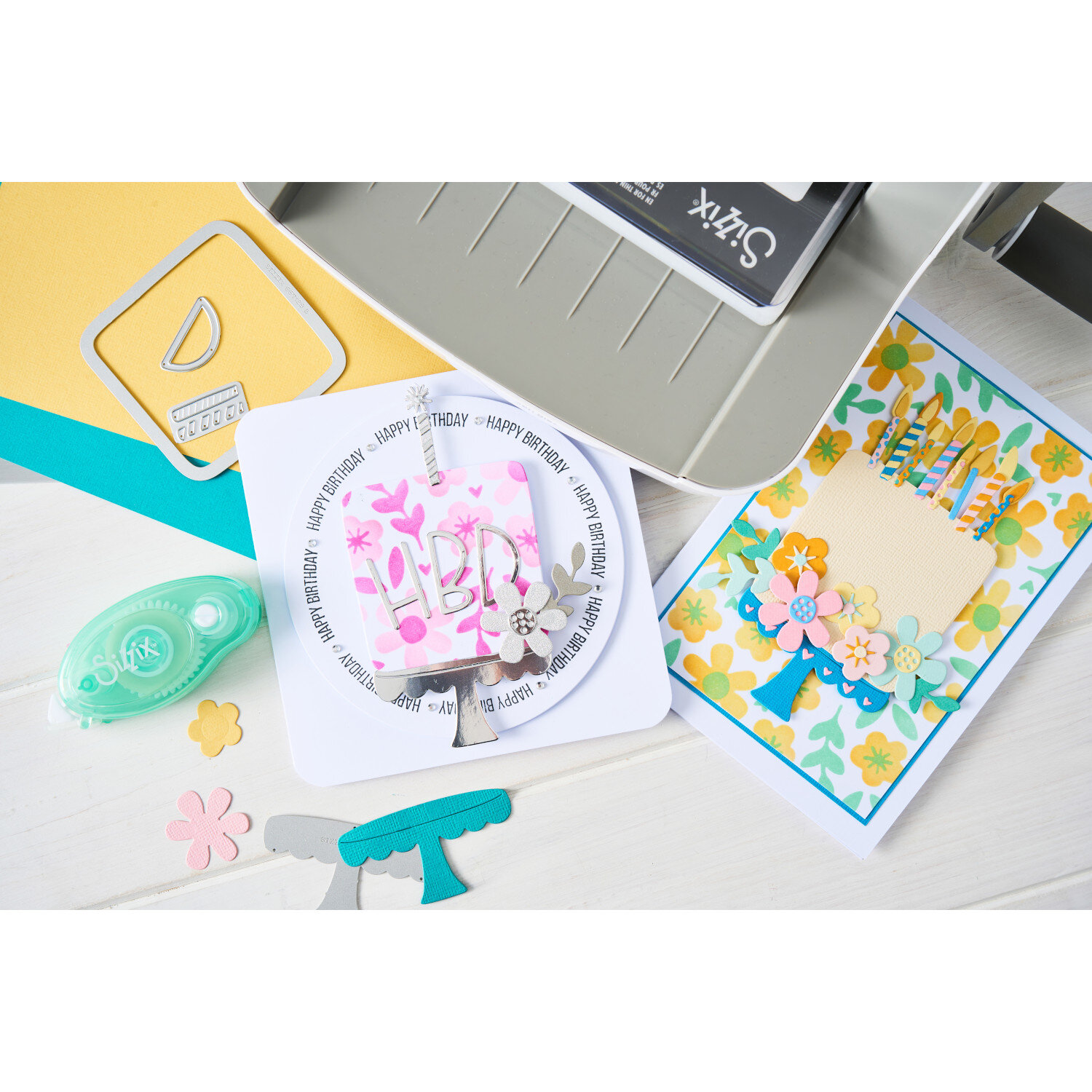 Sizzix Thinlits Die Set Let's Eat Cake 16Stück 2 Schablonen zeigt ausgestanzte Papierdekorationen für Geburtstagskarten mit Torte, Blumen und filigranen Motiven