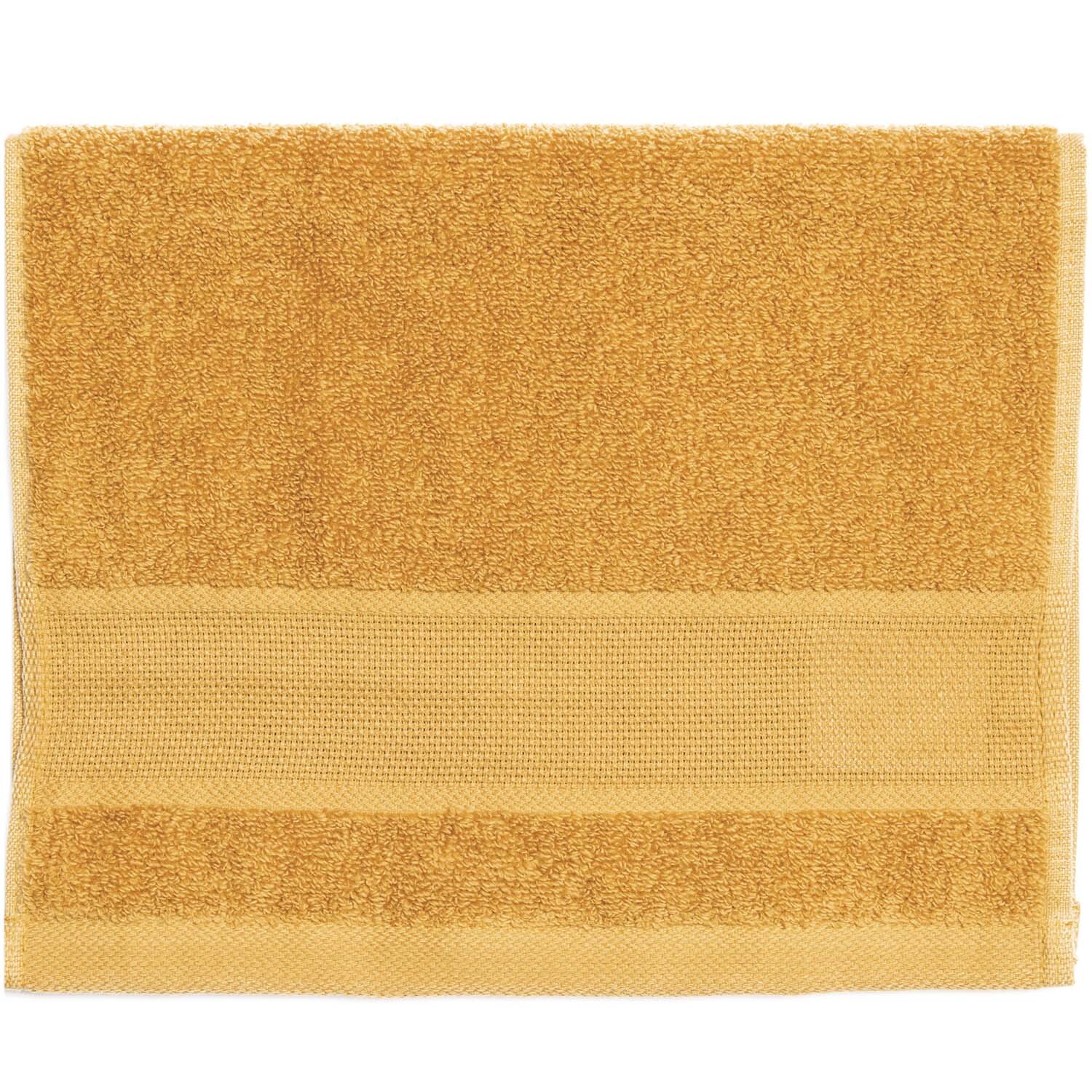 Gästehandtuch 30x50cm in senf dunkel von Rico Design, zeigt weiches Material und elegantes Design.