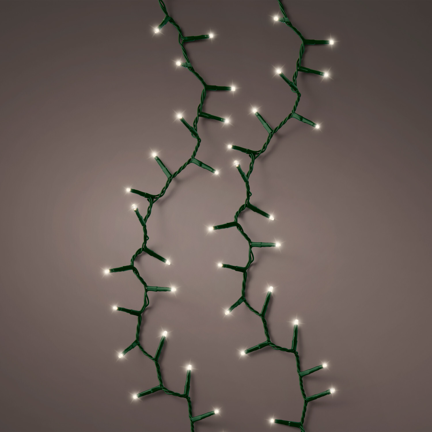 LED Compact Beleuchtung outdoor: Lichterkette mit warmweißen LEDs auf grünem Kabel, Länge 1,1m. Ideal für stimmungsvolle Außenbeleuchtung.