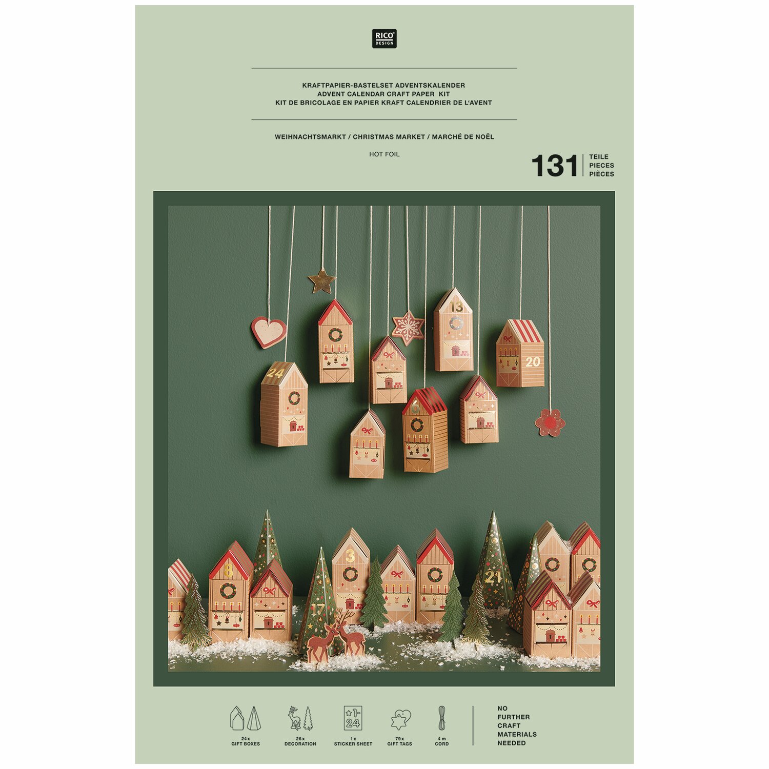 Adventskalender Bastelset von Rico Design mit hängenden und stehenden Häusern in festlichem Design auf grünem Hintergrund.