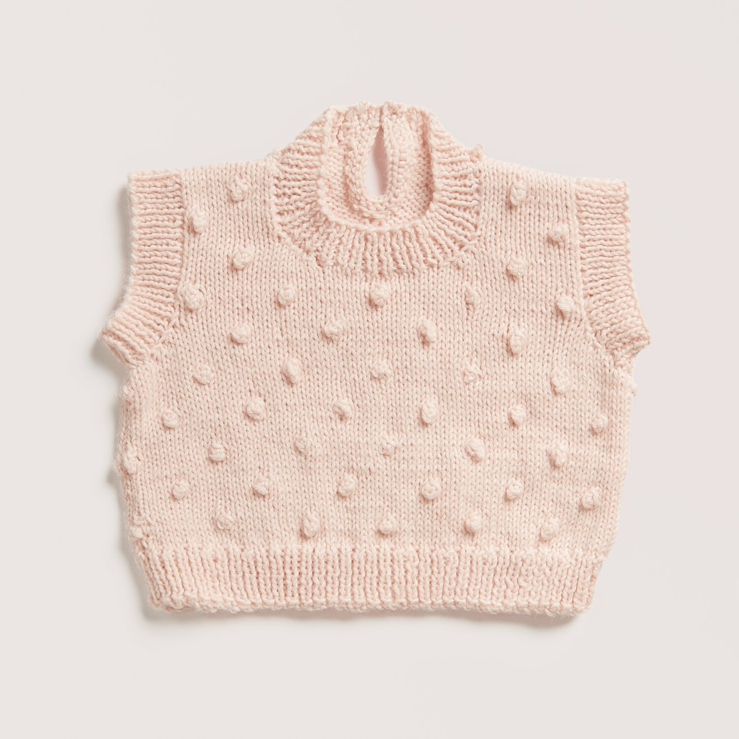 Rico Baby 042 Sprachauswahl deutsch von Rico Design Strickset Top Modell 01 aus Baby 042 in zartem Lachs von Rico Design. Weiches, strukturiertes Strickmuster für Babys.